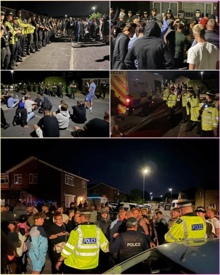 CHAOS IN NORFOLK: Standoff Escalates Outside Asylum Housing! Angry crowds gathered at St. John’s Way demanding the immediate removal of migrants, accusing leaders of betrayal! As tensions boiled over, police formed human shields to protect the complex—until a sudden evacuation plan was leaked… Just as officers moved to secure the building, a shocking action targeted a female officer, forcing riot units to make a split-second decision